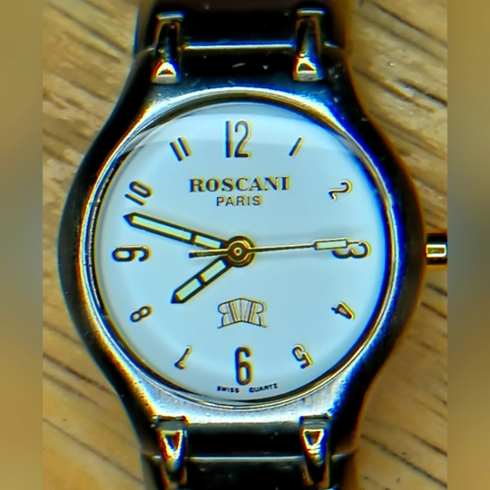 XVery early Roscani Paris watch 25mm SS case, white face 23K Gold plated details